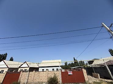 Дома: Дом в с. Новопокровка, ул. Мичурина, 77. - Участок: по документам 3.5 — 1
