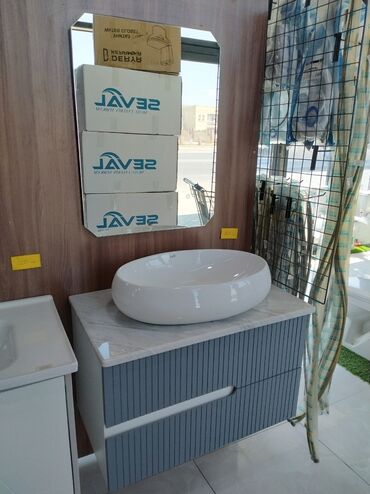 Çanaqlar, tülpanlar: Hamam dolabı ilə bəzədilmiş bu dəst, müasir və funksional hamam mühiti