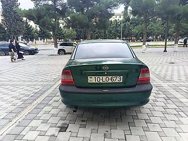kredit avtomobil: Opel Vectra sedan – tünd yaşıl rəng, 4 qapı, 5 yerlik. Şəhər və tras — 6