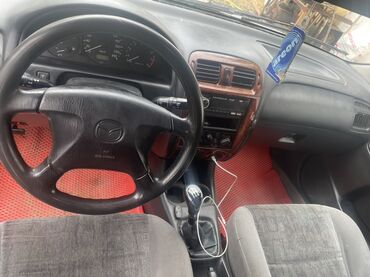 универсальный сканер для диагностики авто: Mazda 626 седан, серебристый, левый руль. - Кузов: 4-дверный седан