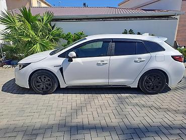 elit ehtiyat hisseleri: Toyota Corolla Touring Sports Hybrid – universal kuzovlu, ağ rəng — 6
