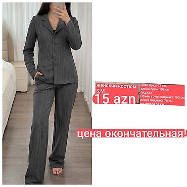 Qadın kostyumu – səliqəli ştrixli (pinstripe) dizayn, boz rəng. Ölçü lalafo.az -da Qadın kostyumu – səliqəli ştrixli (pinstripe) dizayn, boz rəng. Ölçü