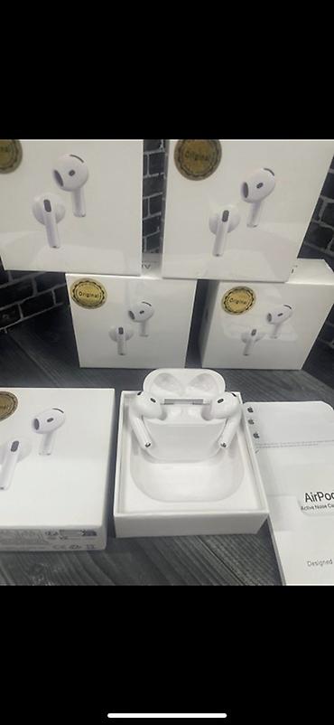 Аудиотехника: Беспроводные наушники-вкладыши Apple AirPods (поколение с укороченной — 2