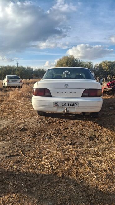 митсубиси поджеро ио: Toyota Camry: 1995 г., Бензин, Седан