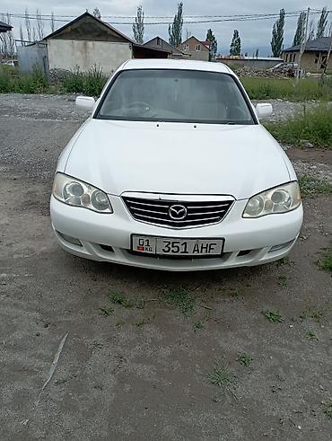 знаки: Mazda Capella: 2003 г., 2.5 л, Автомат, Бензин, Седан — 1