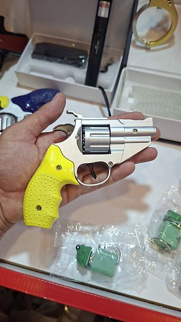 inkişaf etdirici oyuncaqlar: Oyuncaq Rəngli tapança Xüsusiyyətlər: - Revolver tipli - İstifadə — 2