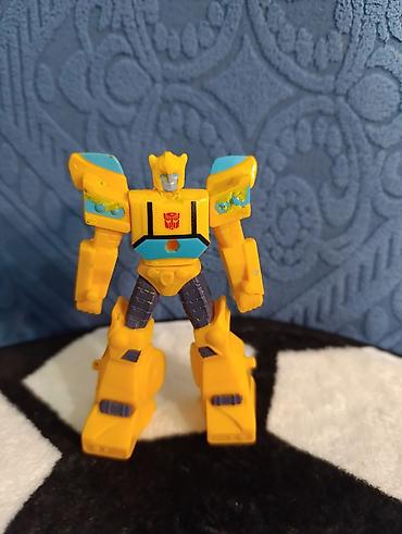 oyuncaq ayi type 1: Transformers üslubunda robot oyuncaq fiquru. Sarı əsas rəngə malikdir — 1