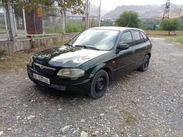 жети орунду машина: Mazda 323: 2000 г., 1.5 л, Механика, Бензин, Хетчбек