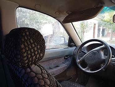 Daewoo: Daewoo Nubira sedan - Kuzov: 4 qapılı sedan, ağ rəng - Ban dizaynı — 7