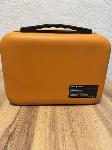 mini pc: Компактный портативный проектор с поворотной подставкой и защитным — 7