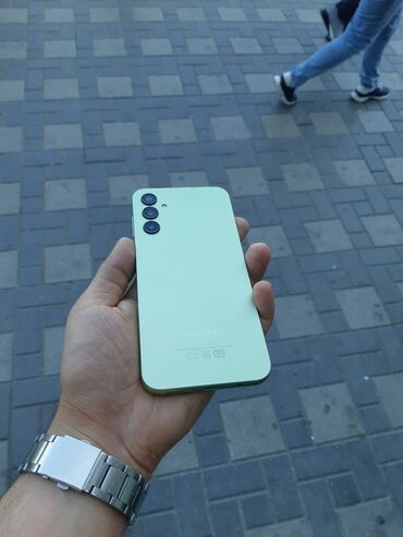 barter telefonlar: Samsung Galaxy A14, 64 ГБ, цвет - Зеленый, Кнопочный, Отпечаток пальца, Face ID