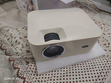 держатель наушников: Проектор Wanbo Projector (модель WB-TXL) - Компактный проектор с — 1