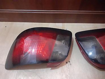 kia rio kompressor: Kia Rio arxa stop kölgə verilmiş sağ yaxşı vəziyyətdədi solda cat var — 1