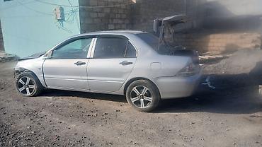 mitsubishi chariot: Mitsubishi Lancer sedan – hissələr üçün - Korpus: 4 qapılı sedan — 3
