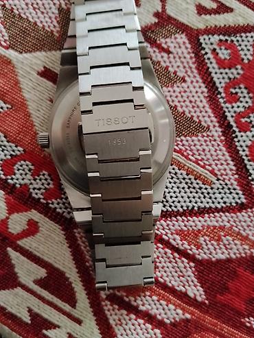 saatdar: Tissot paslanmayan poladdan hazırlanmış kişi/qol saatı. - Marka — 1