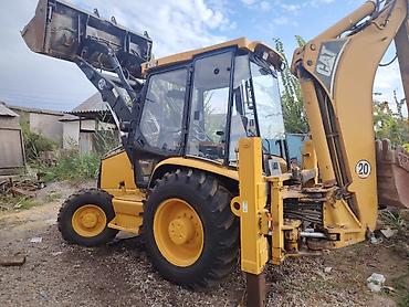 Экскаватор, Caterpillar, 2000 г., Колесный