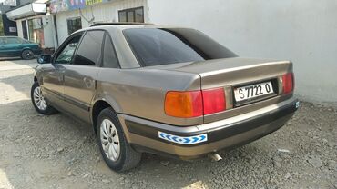 авто из кореи в наличии в бишкеке: Седан Audi 100 в сером цвете. Автомобиль имеет классический дизайн