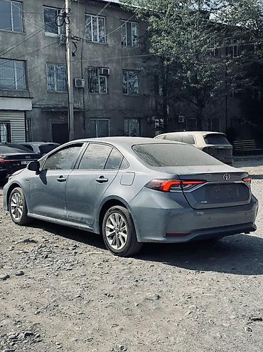 byd e1: Toyota Corolla: 2021 г., 1.8 л, Вариатор, Гибрид, Седан — 2