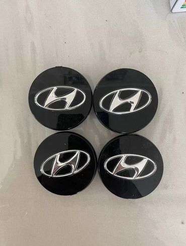 Другие аксессуары для шин, дисков и колес: Колпачки / заглушки ступичные от дисков Hyundai