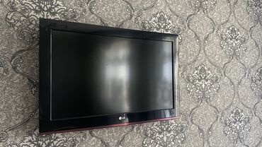 руль для пс3: Телевизор LG с черной рамкой и красной полосой внизу. На задней панели