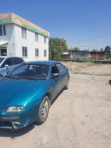 мазда 323 1994: Mazda 323: 1995 г., Хэтчбэк — 4