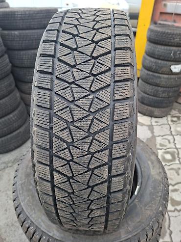 Шины: Bridgestone Blizzak DM‑V2 — комплект зимних шин без шипов. - Размер — 2