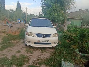 картинговая машина: Белый минивэн Mazda MPV, оснащенный черными дисками и передним