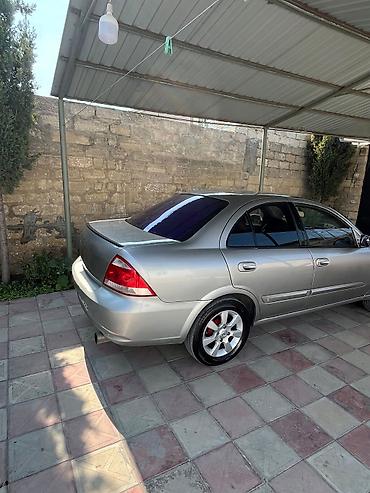 masin cip: Nissan Sunny: 1.6 l | 2008 il Sedan — 6