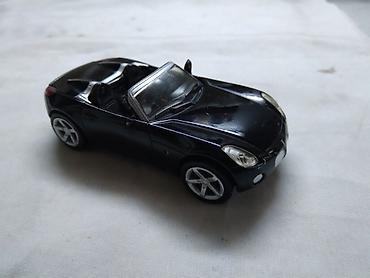 autima: New Ray Pontiac Solstice 2006., oko 1:43(9 cm.),ocuvan,China — 1