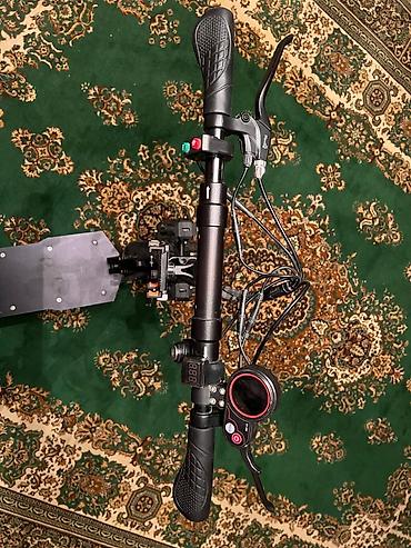 Электротранспорт: Elektrik skuter – oturacaqlı, güclü asqılı və geniş platformalı, 60 km — 4