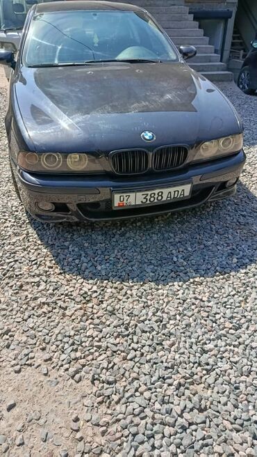 купить двигатель бмв х5 дизель: Черный седан BMW 5 серии, представленный спереди и сбоку. Автомобиль