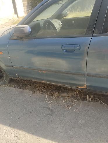 е 34 тарпеда сидения: Mazda 323: 2001 г., 1.6 л, Механика, Бензин, Универсал — 3
