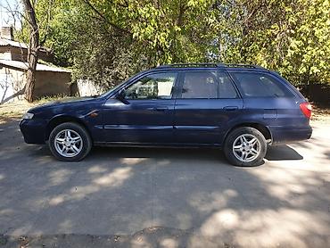 аудио касета: Mazda Capella: 2002 г., 2 л, Механика, Универсал — 4