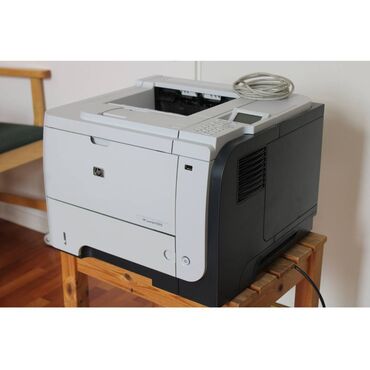 Скоростной принтер с двухсторонней печатью. HP P3015 Лазерный
