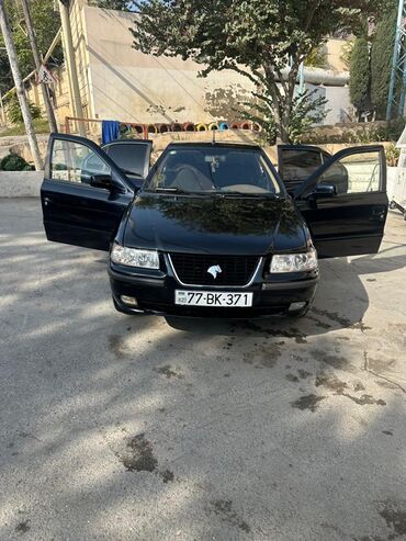 Iran Khodro: İran Khodro Samand (sedan), qara rəng. Xüsusiyyətlər: - Kuzov: 4 — 4