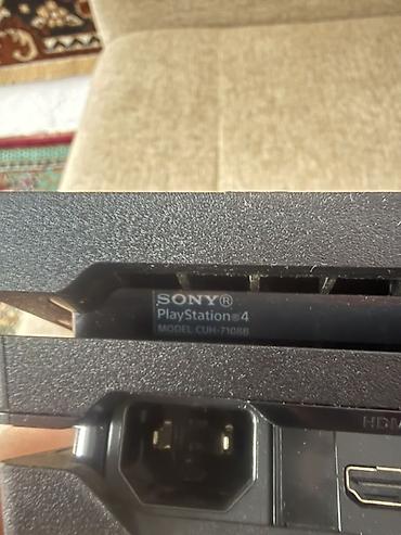 PS4 (Sony PlayStation 4): Игровая консоль Sony PlayStation 4 Pro Модель: CUH-7108B Серия — 4