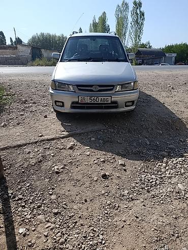Mazda Demio (DW) — компактный хэтчбек/минивэн серебристого цвета с at lalafo.kg Mazda Demio (DW) — компактный хэтчбек/минивэн серебристого цвета с