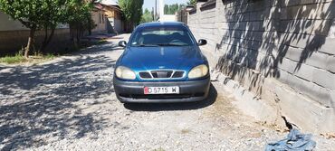 авто в лизинг без банка: Синий седан Daewoo Lanos, который является компактным и экономичным