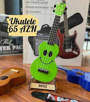 Gitaralar: Görünüşcə Gitaraya bənzəyən ukulele həcmcə daha kiçikdir, simlərinin — 1