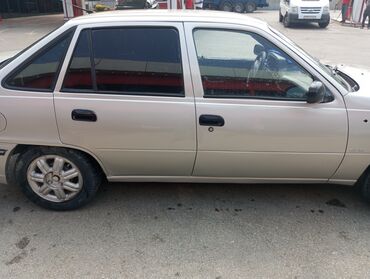 Daewoo: Model: Daewoo Nexia sedan Kuzov: 4 qapılı, gümüşü rəng — 6
