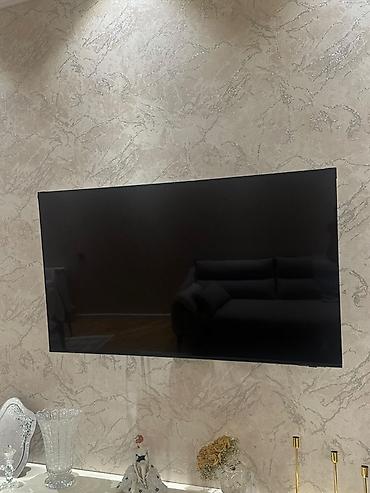 Elektronika: Divar asqısı ilə quraşdırılmış böyük ekran televizor. 55u8000 model — 1