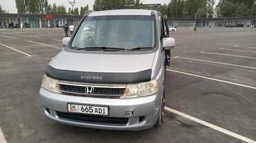 сапог бортовой двух скатный: Серебристый минивэн Honda Stepwgn, оснащенный боковыми сдвижными
