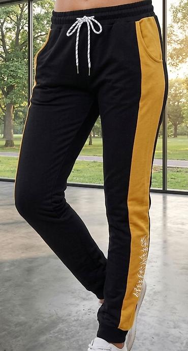bele ski pantalone: Ženske trenerke pantalone – crne sa žutim bočnim panelima - Dizajn — 1