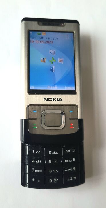 Nokia 6700 Slide, rəng - Gümüşü, Düyməli