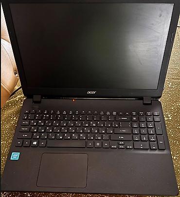 Ноутбуки и аксессуары: Acer brendinə məxsus qara rəngli noutbuk. Cihazda Intel prosessoru — 4