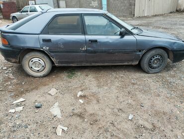 трактор мтз юмз: Mazda 323: 1989 г., 1.6 л, Механика, Бензин, Хэтчбэк