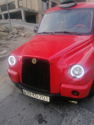 saypa masin: Qırmızı rəngdə olan TX4 taksi avtomobili. Avtomobilin ön hissəsində