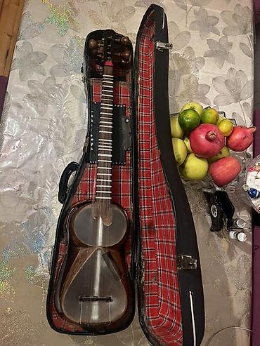 gitara satilir: Tar – milli simli musiqi aləti, sərt futlyarla Xüsusiyyətlər: - — 1