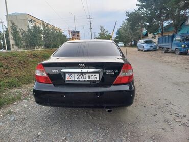 защита двигателя камри 70: Черный седан Toyota Camry XV30, оснащенный двигателем V6. Автомобиль