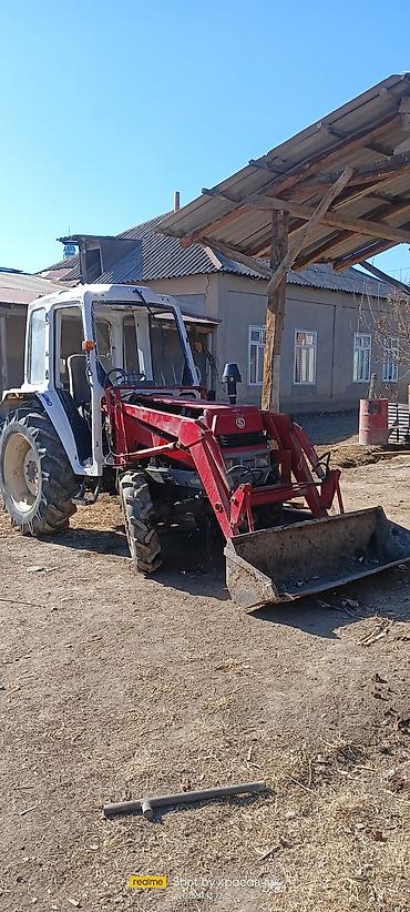 Тракторы ДТ-75: Трактор с фронтальным погрузчиком и навесным оборудованием Описание — 1